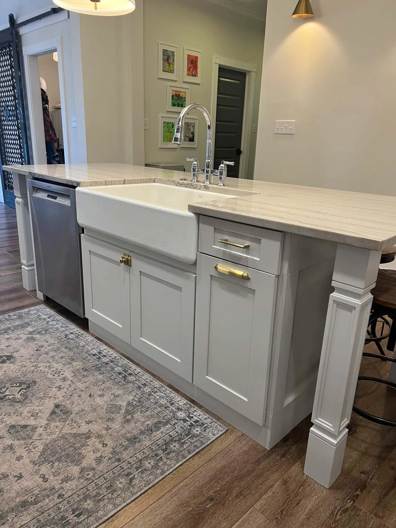 Farmhouse kitchen island with apron sink and quartz top